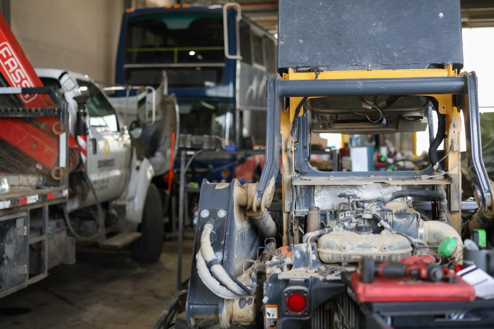 Heavy equipment open in a service bay