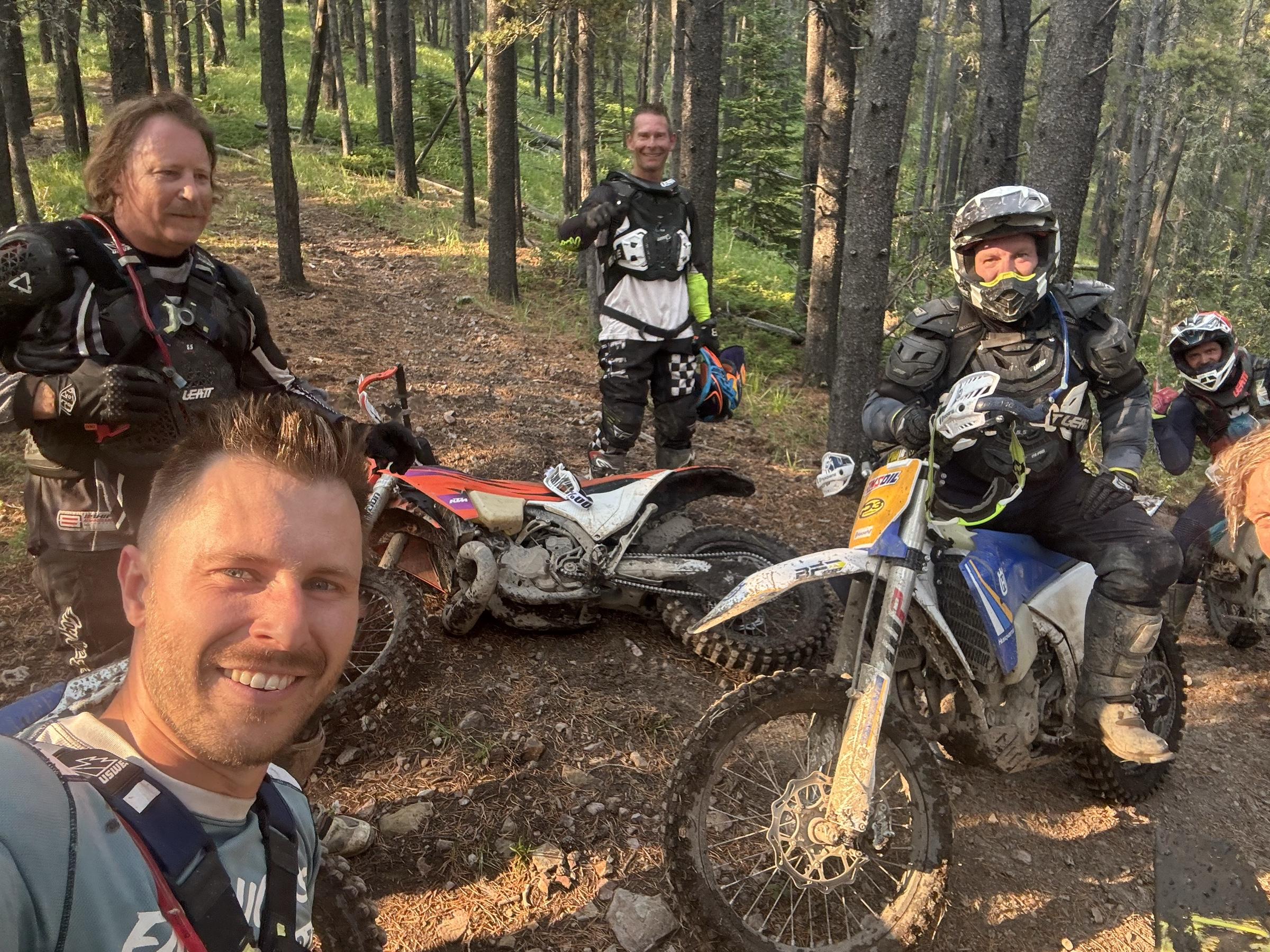 Fabian and friends on a dirt bike trail in the forest