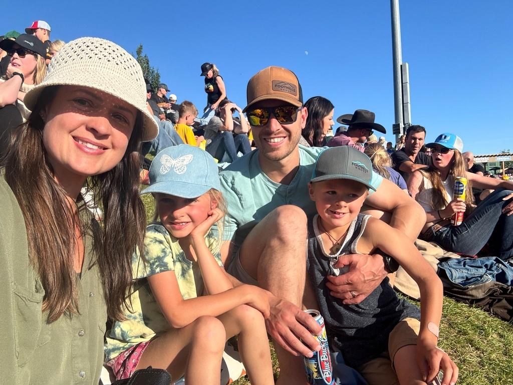 Fabian with his wife and kids at an outdoor event